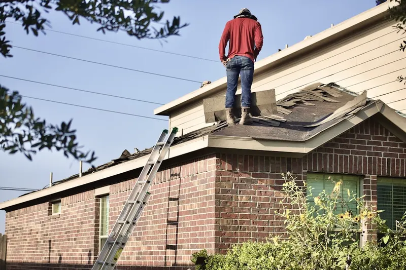 Professional roofer working on a residential roof in San Antonio